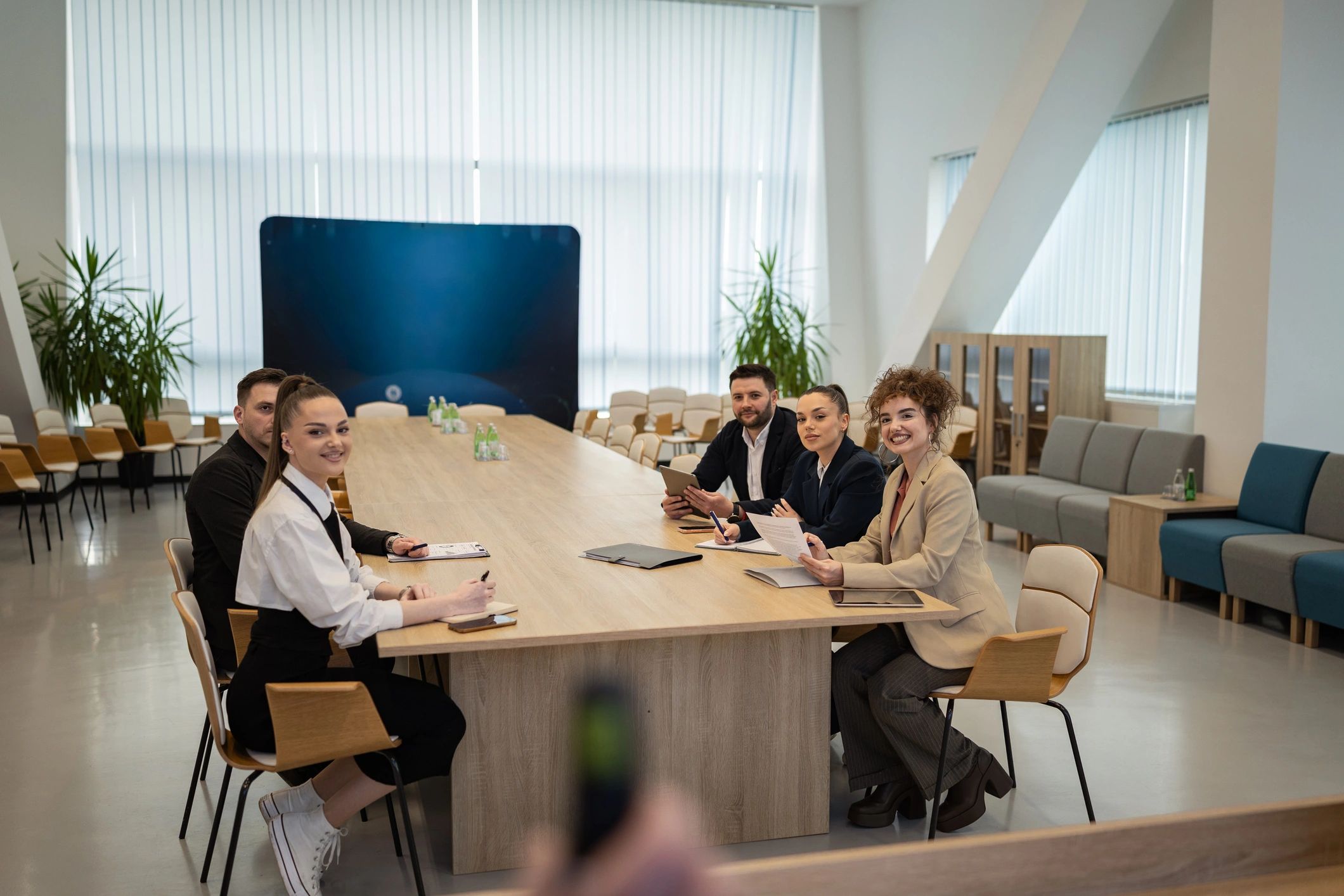Business team collaborating during meeting in boardroom